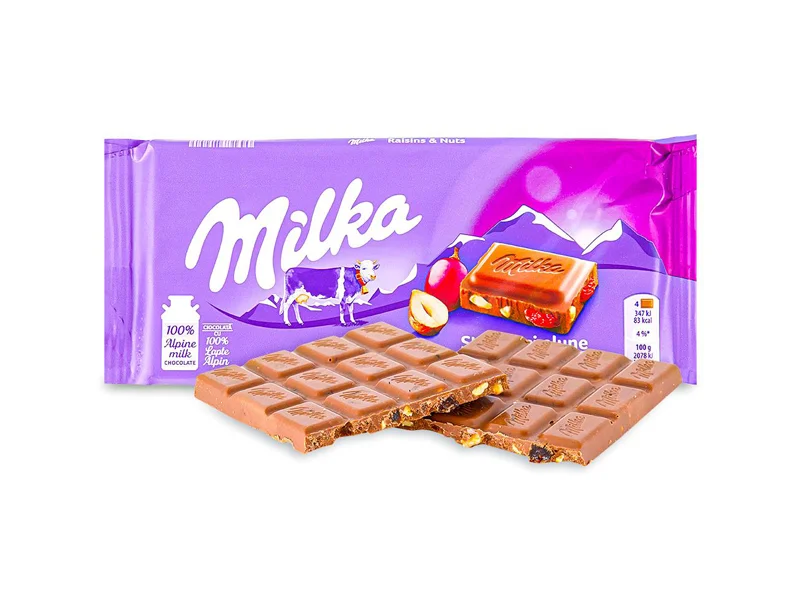 خرید شکلات میلکا با مغز فندق و انگور
